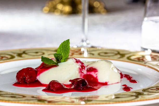 istock Panakota with cherry jelly and mint leaves on a white background 1401802865