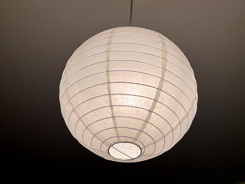 A simple ceiling lamp made of white paper.