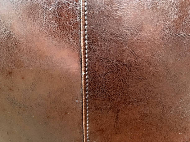 istock A very fine leather with a seam as a texture or background. 1401803755