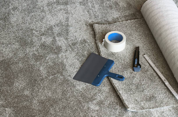 Laying of a new carpet Laying of a new carpet carpet stock pictures, royalty-free photos & images