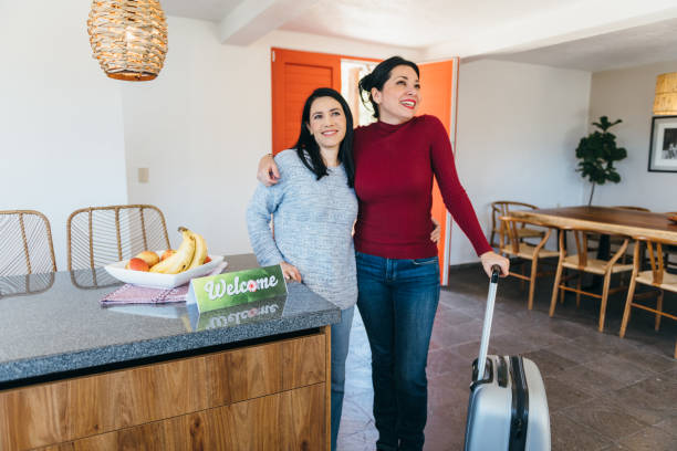 istock Lesbian couple arrive at vacation rental 1401806365