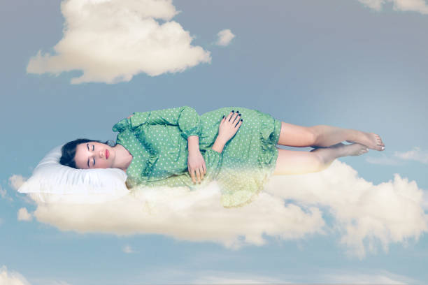 istock Young relax woman in dress sleeping on pillow in the sky. 1401808237