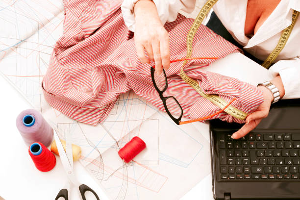 istock woman working in the sewing workshop 1401808622