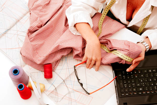istock woman working in the sewing workshop 1401808629