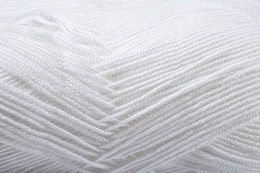 Full frame close-up white wool yarn