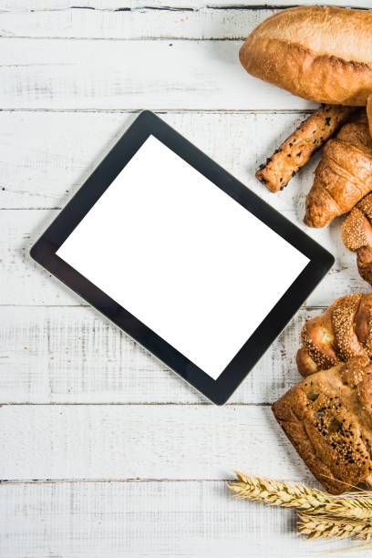istock bakery on wood white background different types of bread 1401812706