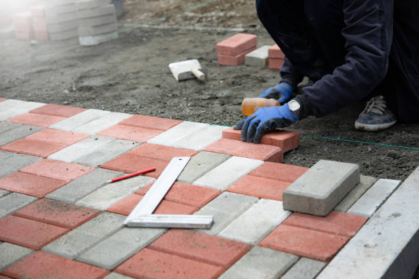istock man holding hammer and stone 1401815130