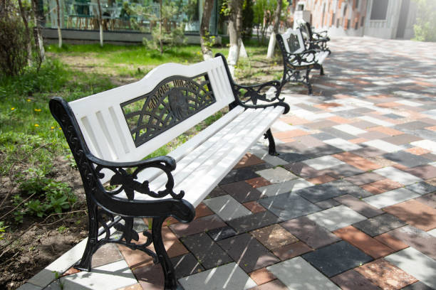 istock Beautiful white bench in public park 1401815172