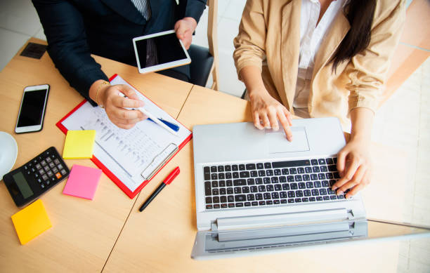 istock Startup diversity teamwork brainstorming meeting concept. Business young multiethnic team working and planning Start Up in modern office. 1401818574