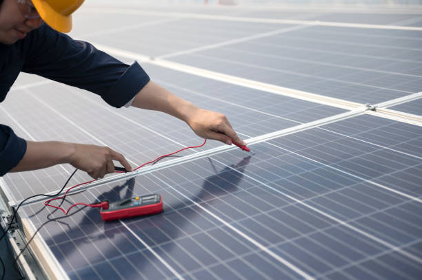 istock Engineering team working operation and maintenance in solar power plant ; engineering team working on checking and maintenance in solar power plant ,solar power plant to innovation of green energy for life 1401828690