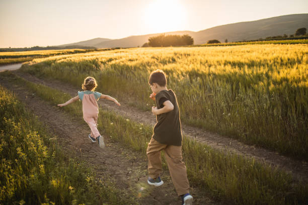 istock Kids running in nature 1401831442