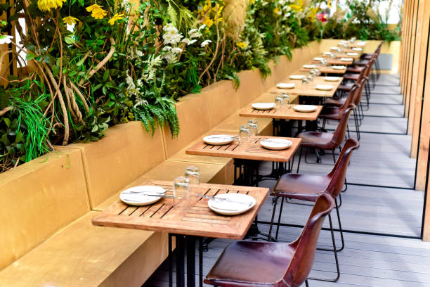 istock Row of Set Tables Outdoors at a Restaurant 1401832754