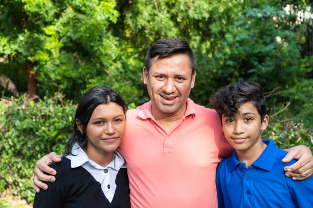 istock Latino fathers and sons outdoors celebrating Father's Day 1401833243