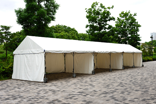 Close-up of empty white tent.