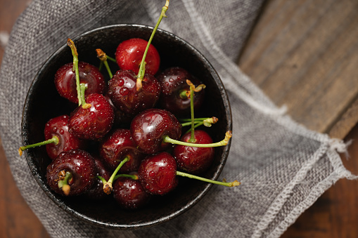 Sweet ripe cherry heap with leaves