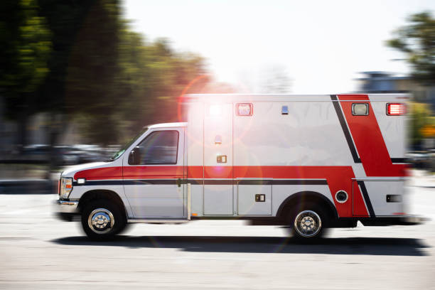 Ambulance Response Blurred motion action view of an ambulance responding to the scene of an emergency. ambulance stock pictures, royalty-free photos & images