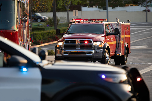 Police, fire, and paramedic units respond to the scene of an emergency.