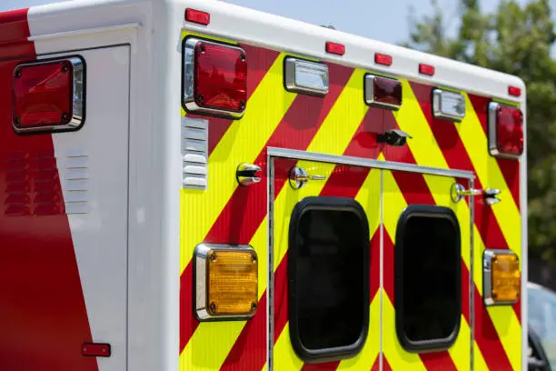 Daytime detailed view of the back of an ambulance.