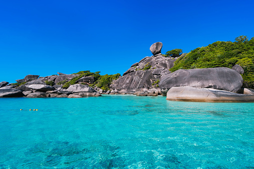 Sailing Rock, clear turquoise sea and blue sky on Koh Similan island, group Similan Islands, Andaman sea, travel attraction in Phang Nga, Thailand.