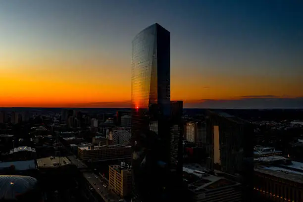 Photo of Gorgeous Aerial View of Philadelphia, Pennsylvania Sunset Reflecting Off Glass Skyscraper From Drone Point Of View