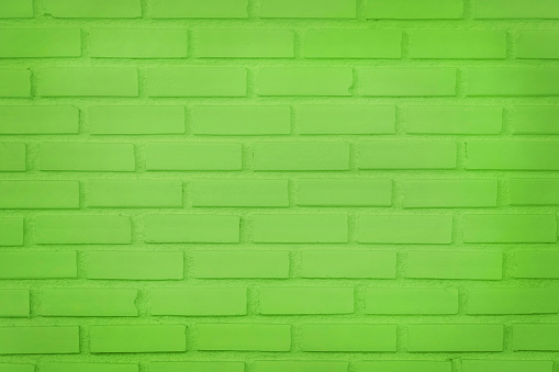 Light green brick concrete wall texture for background and design art work.