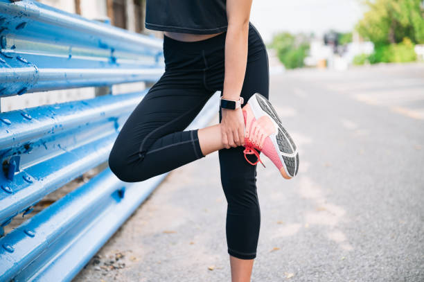 istock Girl stretching leg before jogging 1401854331