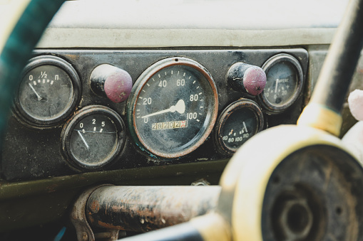 Dashboard in an old truck close-up. Speedometer and gauges
