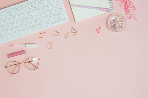 istock Working items for woman concept over the pink background. 1401860982