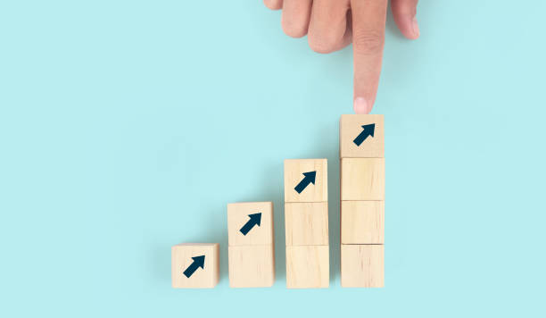 istock Business connecting piece of multi wood chart blocks steps in hand 1401862357