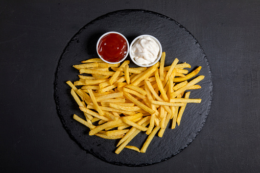 French Fries are also known as chips in some countries, made from potato and deep-fried in hot oil.