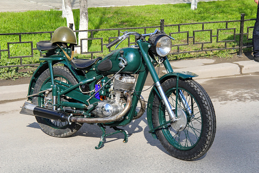Ekaterinburg, Russia - May 9, 2012: Green retro motorcycle Izh-49 takes part in the retro car show of the Victory Day.