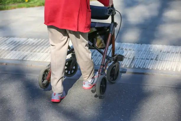 elderly woman with wheeled walker