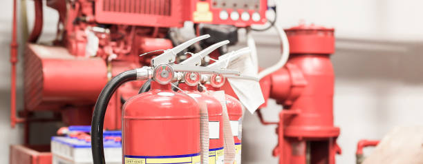 istock The red fire extinguisher is ready for use in case of an indoor fire emergency. 1401866217