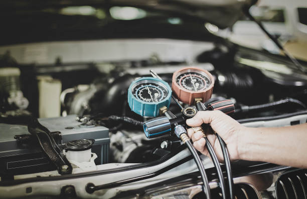 istock Car air conditioner check service, leak detection, fill refrigerant. 1401866230