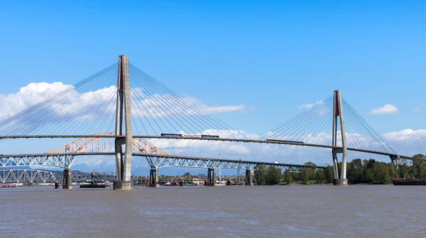 SkyTrain passing the SkyBridge. A cable-stayed bridge in Metro Vancouver. stock photo