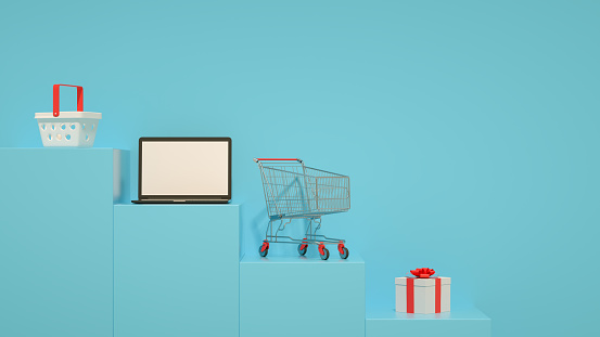 3d rendering of online shopping laptop shopping basket on podium.