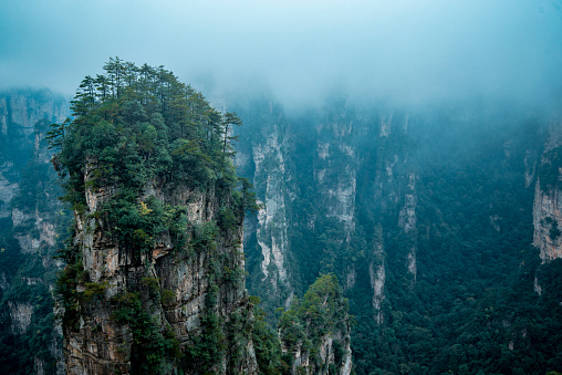 Amazing landscape of mountain and forest in the foggy at Wulingyuan, Hunan, China. Wulingyuan Scenic and Historic Interest Area which was designated a UNESCO World Heritage Site in China