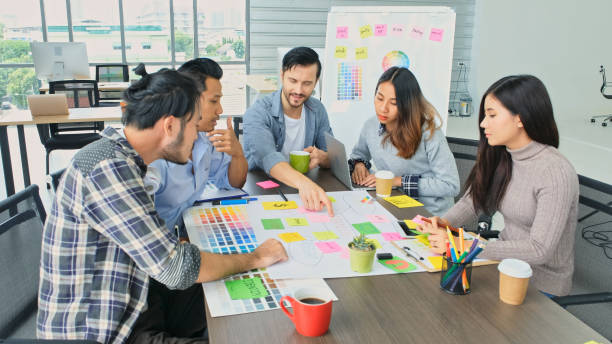 istock Young creative design meeting brainstorm ideas to plan and develop project together in office, Small business startup coworker, colleagues working  for the small business solution, People in office lifestyle 1401871407