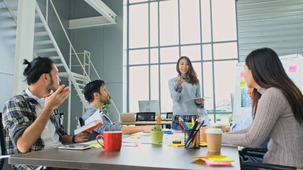 istock Young creative design meeting brainstorm ideas to plan and develop project together in office, Small business startup coworker, colleagues working  for the small business solution, People in office lifestyle 1401871557