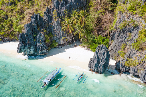 Landscape aerial view of the coastline of Kata beach on the resort island of Phuket in Thailand. Phuket is a world wide famous destination for tourism and people in search of beach, sun and crystal waters.