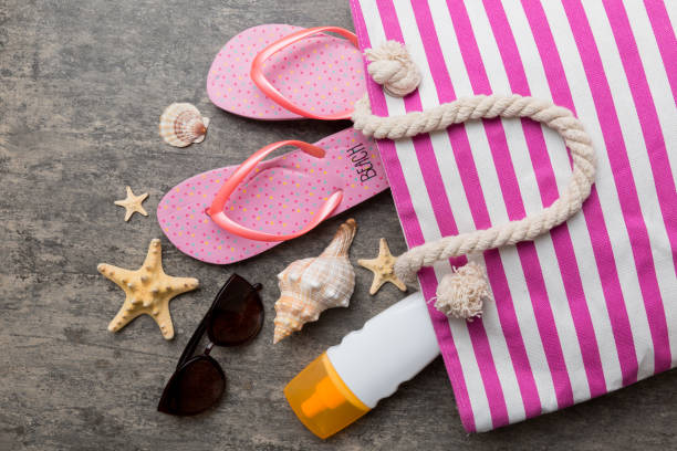 istock beach accessories flat lay top view on colored background Summer travel concept. Bag with starfish and sea shell. Top view 1401877777