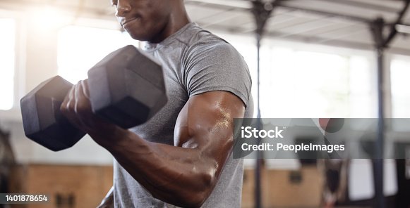 istock Unknown african american athlete lifting dumbbell during bicep curl arm workout in gym. Strong, fit, active black man training with weight in health and sports club. Weightlifting exercise routine 1401878654