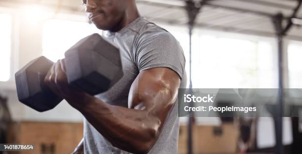Unknown African American Athlete Lifting Dumbbell During Bicep Curl Arm Workout In Gym Strong Fit Active Black Man Training With Weight In Health And Sports Club Weightlifting Exercise Routine Stock Photo - Download Image Now