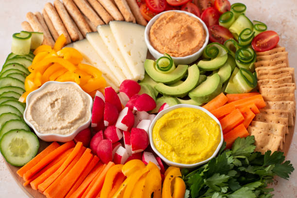 istock Colorful vegan Charcuterie board with raw vegetables and whole wheat snacks 1401879802