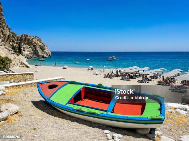 Boat At Idyllic Beach Kira Panagia Karpathos Island Greece Stock Photo - Download Image Now
