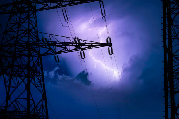 Tower of high voltage cables High voltage cable tower in a lightning storm lightning tower stock pictures, royalty-free photos & images