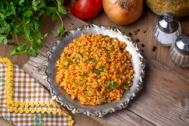 istock Traditional turkish bulgur pilaf with tomato sause in plate (Turkish name; meyhane pilavi) 1401882046