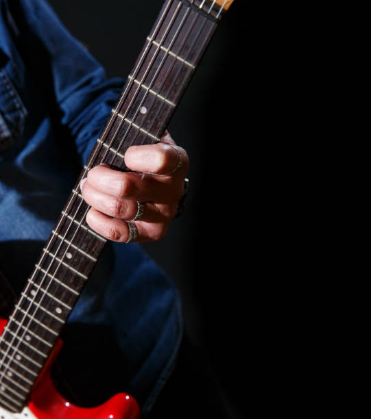 istock elderly man plays the electric guitar 1401887394
