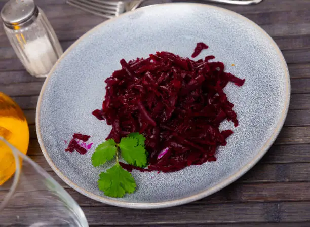 Photo of Salad of grated boiled beets with olive oil and greens