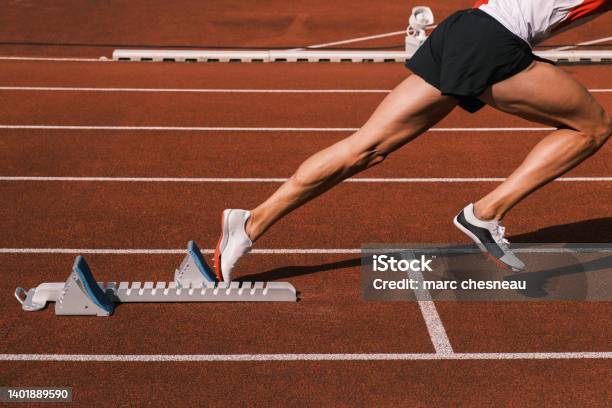 A Rider At The Start On A Track Stock Photo - Download Image Now - Track And Field, Track Starting Block, Running
